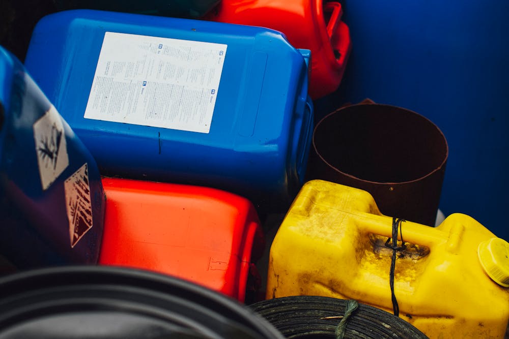 Several Plastic Containers Containing Liquid Waste