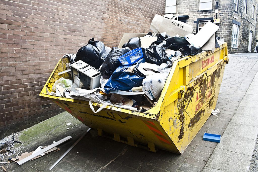 A skip bin that is full of rubbish