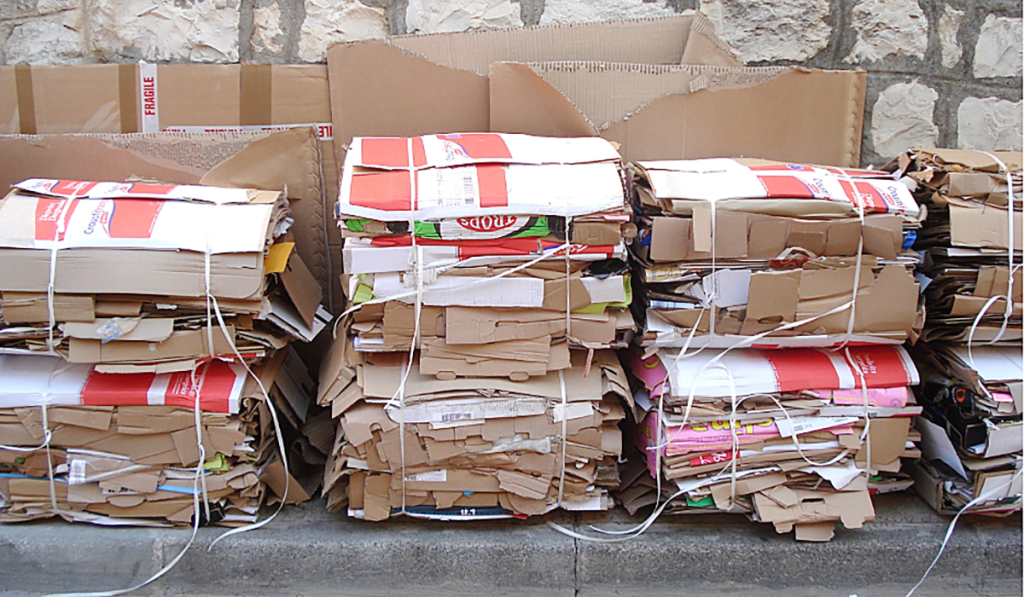 Several stacks of cardboard bundled together