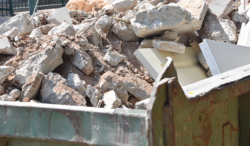 Concrete rubble in a skip bin awaiting recycling or responsible disposal from a construction project.