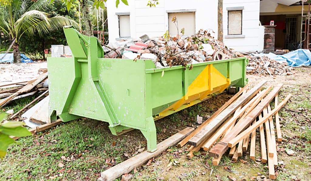 Construction skip bin filled with building and demolition waste at a residential worksite